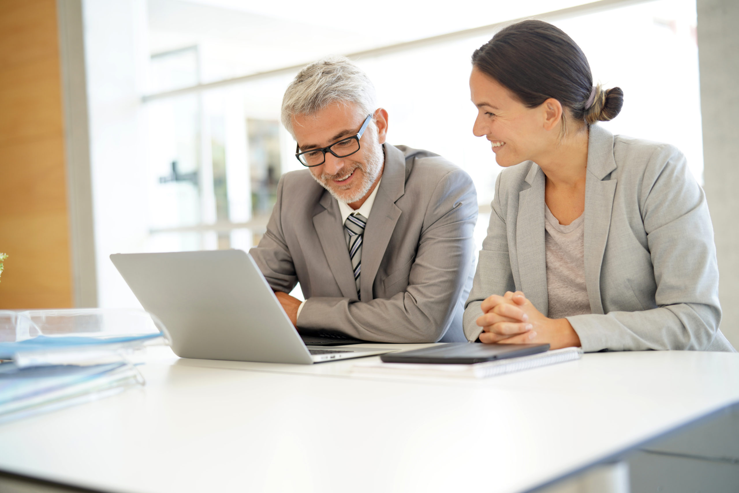 Corporate business coleagues working together in modern office